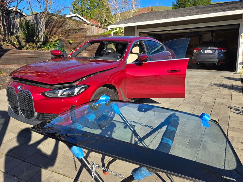 BMW iX windshield on stand ready for installation in Los Angeles
